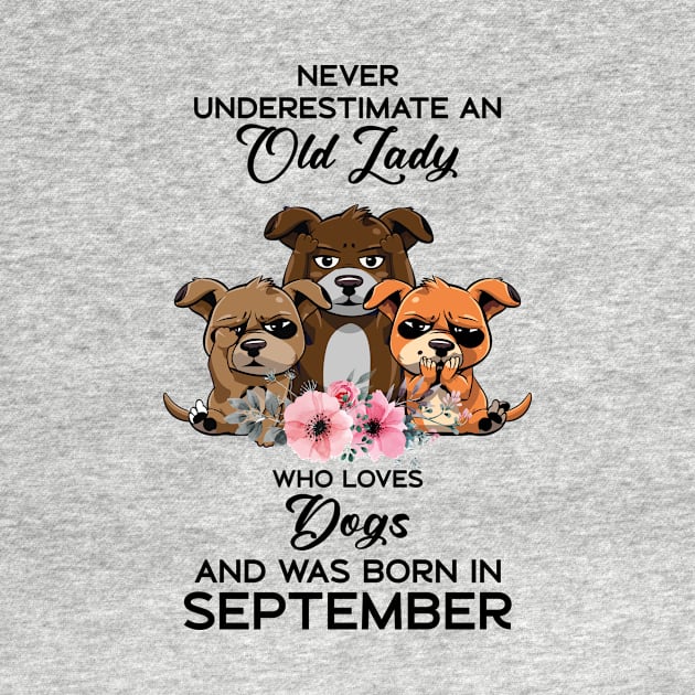 Never Underestimate An Old Woman Who Loves Dogs And Was Born In September by Happy Solstice